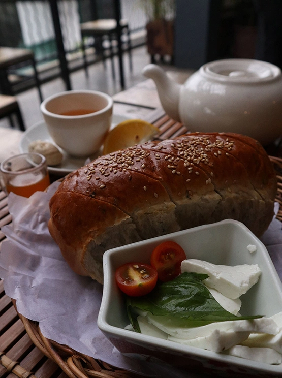 Cafe by the ruins Baguio - Bread with kesong puti and basil