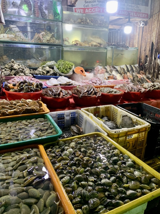 Fresh seafoods in Macapagal Seaside wet market mussels and lobsters